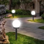 Round Solar Garden Light, Dusk-to-Dawn in a styled room setting - Vivotee